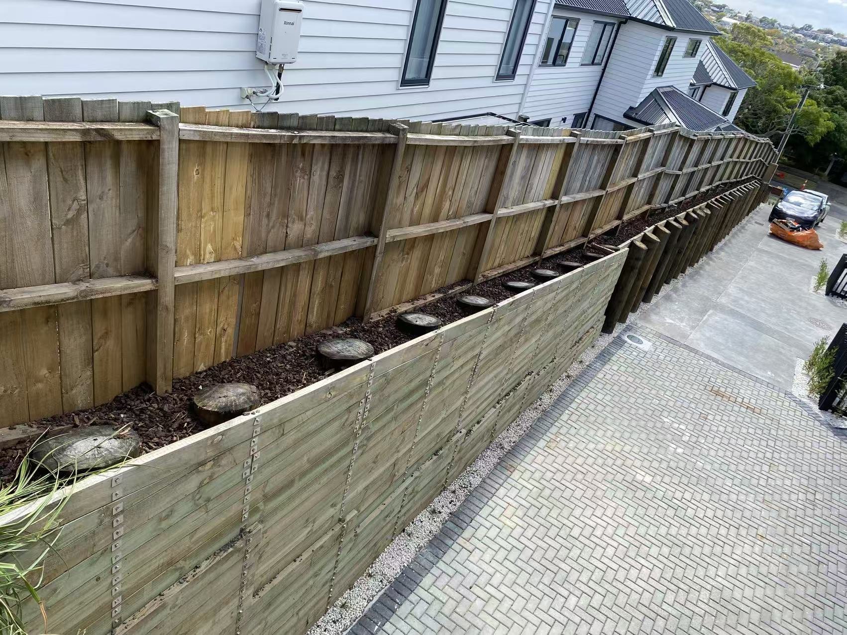 Timber retaining wall beside a residential development on Aragon Avenue, Glendowie